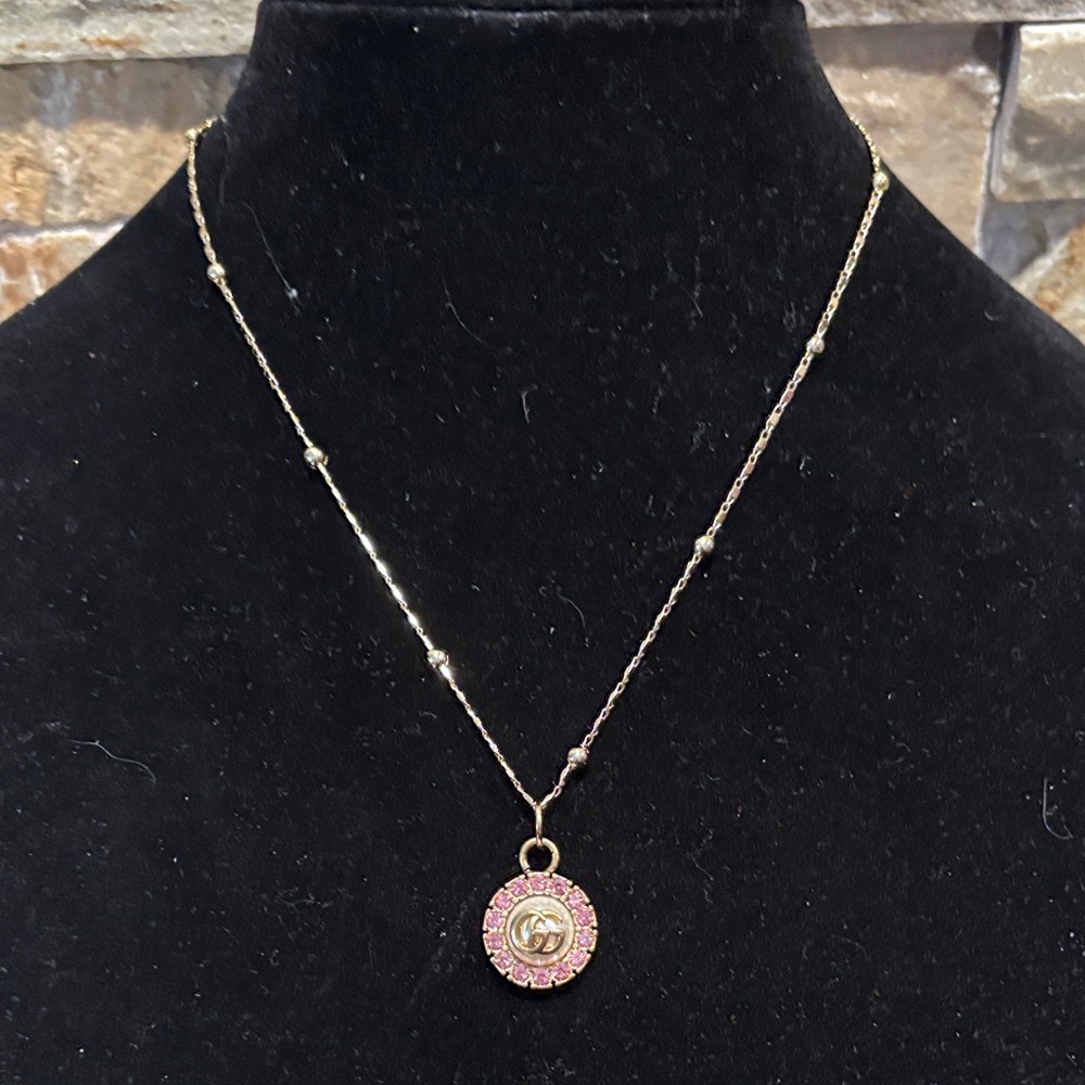 Gold-Tone Pendant Necklace with Pink Crystal Accent - Designer Logo Style